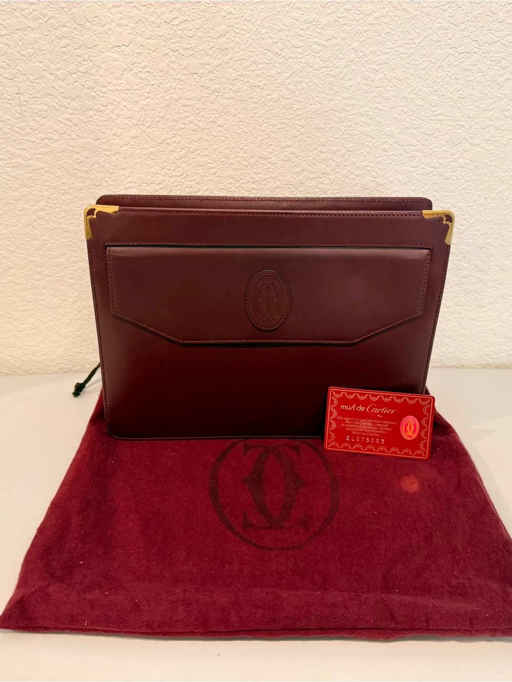 Cartier Burgundy Leather clutch with Gold Accents and COA